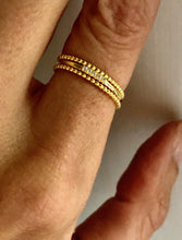 Load image into Gallery viewer, Our Dainty Five Diamond Ring is beautiful and simple. You can wear it alone for minimalist look or as part of a stack of rings to add the perfect amount of sparkle.      925 sterling silver with 18K gold plating     Diamonds are AAA cubic zirconia