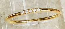 Load image into Gallery viewer, Our Dainty Five Diamond Ring is beautiful and simple. You can wear it alone for minimalist look or as part of a stack of rings to add the perfect amount of sparkle.      925 sterling silver with 18K gold plating     Diamonds are AAA cubic zirconia