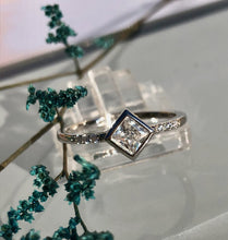 Load image into Gallery viewer, This ring is truly unique. Our Diamond Solitaire Ring adds just the right touch to any outfit for any occasion.      925 sterling silver with 3 layers of rhodium plating     Diamond is AAAA cubic zirconia