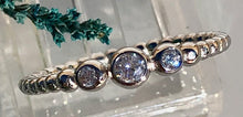 Load image into Gallery viewer, Our Three Diamond Dot Band Ring is just simply beautiful. Classically designed it can be worn alone but stacks beautifully with any set of rings. The perfect daily wear ring that you will never want to take off - you won't have too! Jewelry that is 925 sterling silver with 3 layers of rhodium plating Diamonds are AAAA cubic zircon