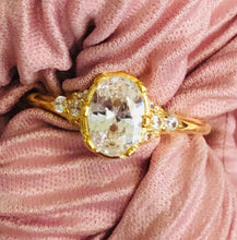 Load image into Gallery viewer, Our Oval Diamond Ring is a beautiful statement ring that shines best on its own. It is sure to get attention with its perfect balance of modern and vintage. You wont ever want to take it off! Jewelry that is 925 sterling silver with 18K gold plating AAAA cubic zirconia
