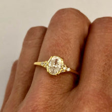 Load image into Gallery viewer, Our Oval Diamond Ring is a beautiful statement ring that shines best on its own. It is sure to get attention with its perfect balance of modern and vintage. You wont ever want to take it off! Jewelry that is 925 sterling silver with 18K gold plating AAAA cubic zirconia