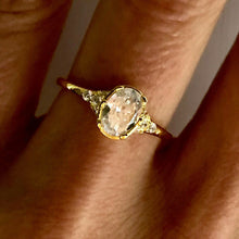 Load image into Gallery viewer, Our Oval Diamond Ring is a beautiful statement ring that shines best on its own. It is sure to get attention with its perfect balance of modern and vintage. You wont ever want to take it off! Jewelry that is 925 sterling silver with 18K gold plating AAAA cubic zirconia