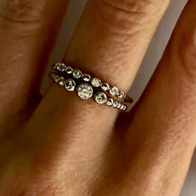 Load image into Gallery viewer, Our Three Diamond Dot Band Ring is just simply beautiful. Classically designed it can be worn alone but stacks beautifully with any set of rings. The perfect daily wear ring that you will never want to take off - you won't have too! Jewelry that is 925 sterling silver with 3 layers of rhodium plating Diamonds are AAAA cubic zircon