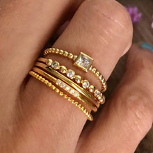 Load image into Gallery viewer, Our dainty diamond dot eternity band is simple and beautiful. You can wear it alone for a minimalist look or as part of a stack for a boho chic look. Jewelry that is 925 sterling silver with rhodium or 18K gold plating Diamonds at AAA cubic zirconia