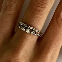 Load image into Gallery viewer, Our dainty diamond dot eternity band is simple and beautiful. You can wear it alone for a minimalist look or as part of a stack for a boho chic look. Jewelry that is 925 sterling silver with rhodium or 18K gold plating Diamonds at AAA cubic zirconia