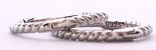 Load image into Gallery viewer, Our dainty Twist Huggie Hoop Earrings are the earrings you never knew you needed. They give just the right shine to wear alone, but are dainty enough to wear with any earring stack. They are a must have and made from durable material to withstand daily wear. Jewelry that is 925 sterling silver with platinum or 18K gold plating very light weight and hypoallergenic