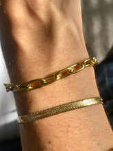 Load image into Gallery viewer, Our Bold Paperclip Bracelet is beautiful on its own but will pair wonderfully to any of your favorite bracelets. Add your favorite charms to personalize it.      18k plated stainless steel (water resistant)      6.5 inches long with toggle clasp      hypoallergenic