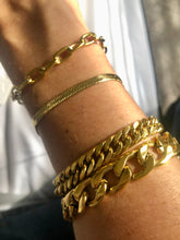 Load image into Gallery viewer, Our Bold Paperclip Bracelet is beautiful on its own but will pair wonderfully to any of your favorite bracelets. Add your favorite charms to personalize it.      18k plated stainless steel (water resistant)      6.5 inches long with toggle clasp      hypoallergenic