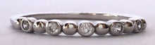 Load image into Gallery viewer, Our dainty diamond dot eternity band is simple and beautiful. You can wear it alone for a minimalist look or as part of a stack for a boho chic look. Jewelry that is 925 sterling silver with rhodium or 18K gold plating Diamonds at AAA cubic zirconia