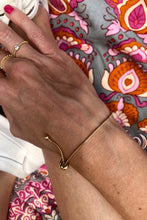 Load image into Gallery viewer, This beautiful adjustable snake bracelet is so easy to wear you’ll never want to take it off. It goes with any outfit or bracelet stack. It’s truly a jewelry staple!   18k gold plated stainless steel  8.5in max length  water resistant