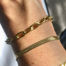 Load image into Gallery viewer, Our Bold Paperclip Bracelet is beautiful on its own but will pair wonderfully to any of your favorite bracelets. Add your favorite charms to personalize it.      18k plated stainless steel (water resistant)      6.5 inches long with toggle clasp      hypoallergenic
