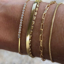 Load image into Gallery viewer, This beautiful adjustable snake bracelet is so easy to wear you’ll never want to take it off. It goes with any outfit or bracelet stack. It’s truly a jewelry staple!   18k gold plated stainless steel  8.5in max length  water resistant