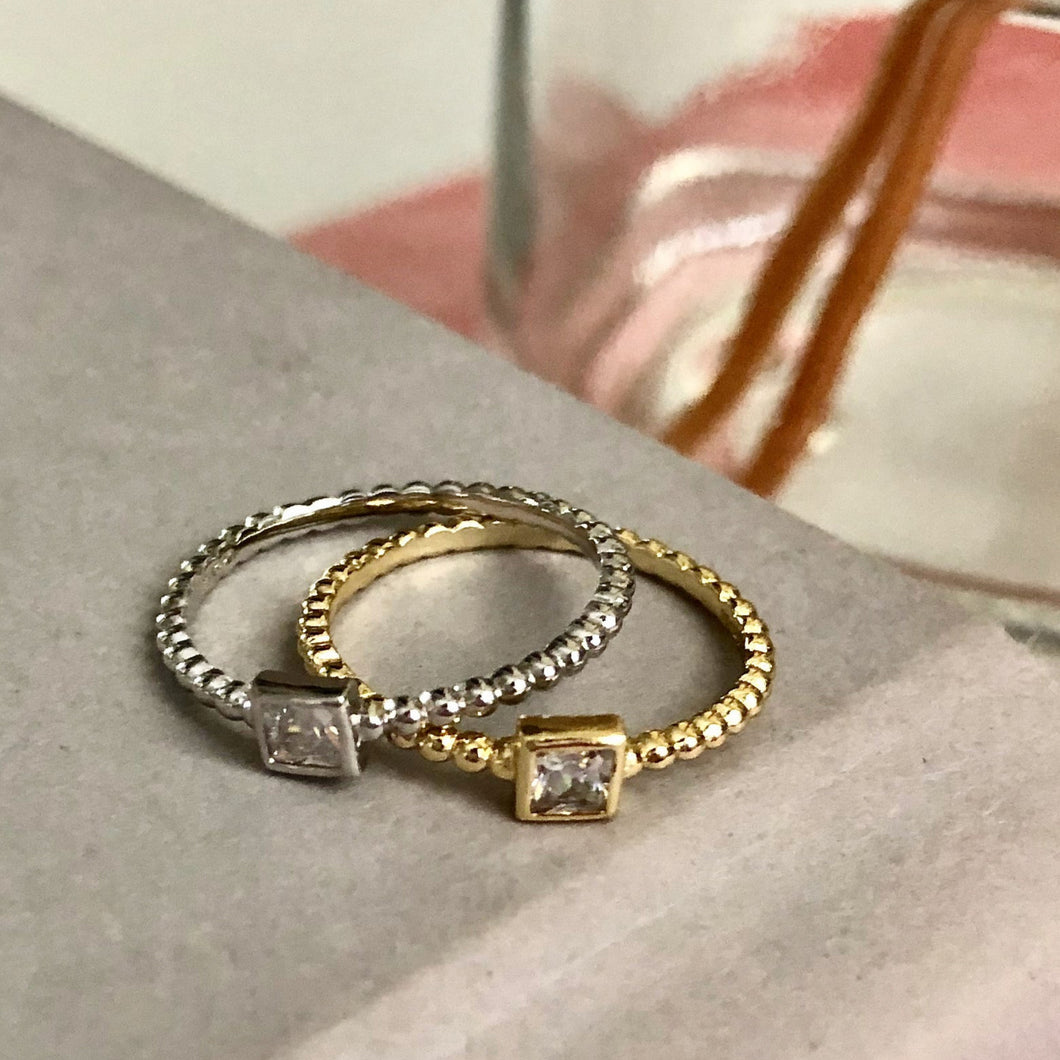 Our Dot Band Square Diamond Ring is another truly unique design. Its beautiful worn alone for a minimalist look but also perfectly designed to stack; it might be the perfect everyday ring. Jewelry that is 925 sterling silver with rhodium or 18K gold plating Diamond is a AAA cubic zirconia