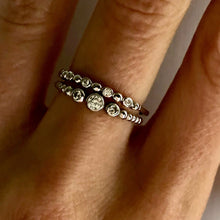 Load image into Gallery viewer, Our Three Diamond Dot Band Ring is just simply beautiful. Classically designed it can be worn alone but stacks beautifully with any set of rings. The perfect daily wear ring that you will never want to take off - you won&#39;t have too! Jewelry that is 925 sterling silver with 3 layers of rhodium plating Diamonds are AAAA cubic zircon
