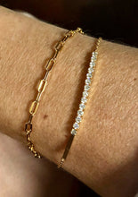 Load image into Gallery viewer, Our simple Paperclip Bracelet this the trendy piece you are going to want to hang on to. It is beautiful any way you wear it and perfect for daily wear. It can be worn alone or stacked with other bracelets. Ether way its going to shine. Jewelry that is 925 Sterling Silver with platinum or 18K gold plating 6.5 inches long with 1 in extender

