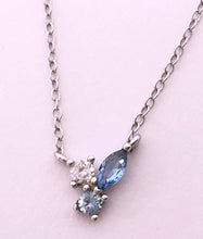 Load image into Gallery viewer, Our Dainty Blue Stone Cluster necklace is perfect to wear alone everyday to add a little shine to any look. It can also be the finishing touch to any layered stack.      925 sterling silver with platinum or 18K gold plating     Stones are AAAA cubic zirconia in white, light blue, and dark blue     16 inch chain with adjustable extender
